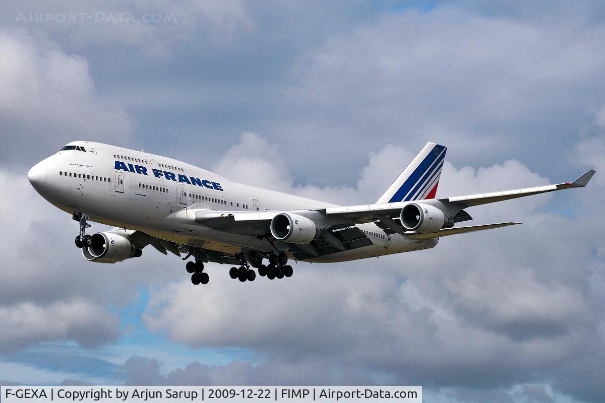 F-GEXA, 1989 Boeing 747-4B3 C/N 24154, On short final for Rwy 14 at Plaisance on a cloudy summer morning.