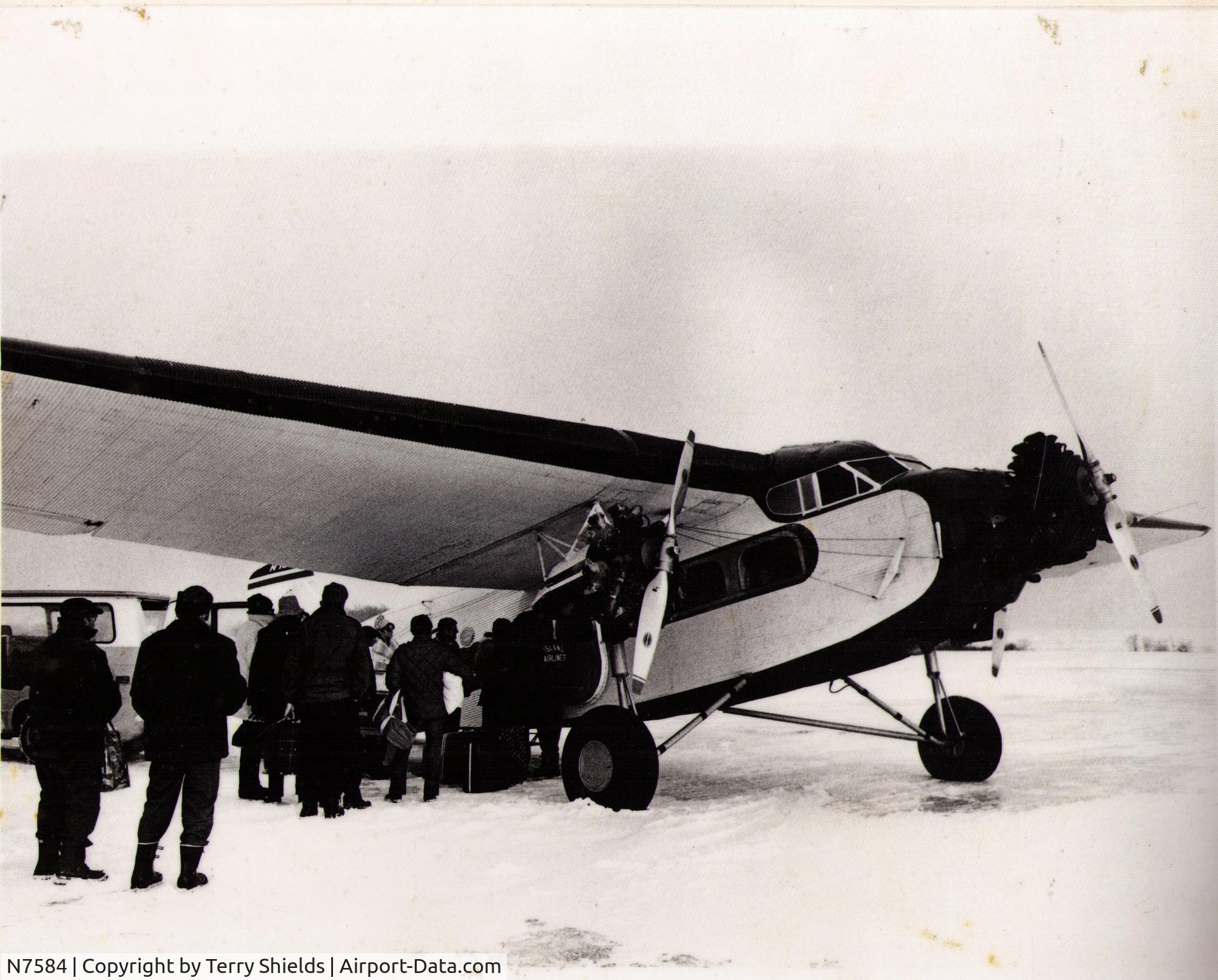 N7584, 1928 Ford 4-AT-B Tri-Motor C/N 38, Picking up ice fishermen on Lake Erie just south of Middle Bass Island, OH. (1975). I flew this Ford Tri-Motor 4T-B for three years for Island Airlines out of Port Clinton, OH. Someone bought the aircraft after Island Airlines went out of business. Heard