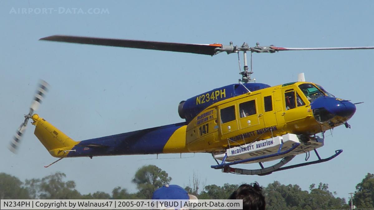 N234PH, 1977 Bell 214B-1 Biglifter C/N 28050, Stbd view of McDermott Aviation Bell 214B-1 Biglifter N234PH Cn 28050 ‘arrival’ at Bundaberg Airshow at Bundaberg Airport YBUD on 16Jul2005. Equipped with ‘under-cabin’ water tank, with ‘pick-up’ hose retracted.