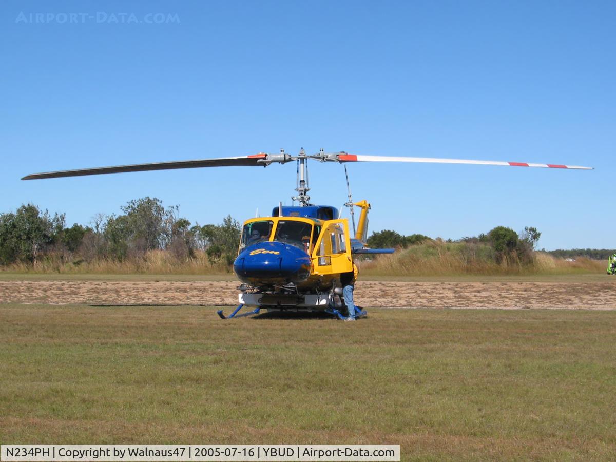 N234PH, 1977 Bell 214B-1 Biglifter C/N 28050, Front view of McDermott Aviation Bell 214B-1 Biglifter N234PH Cn 28050 parked at Bundaberg Airshow at Bundaberg Airport YBUD on 16Jul2005. Equipped with ‘under-cabin’ water tank, with ‘pick-up’ hose retracted.