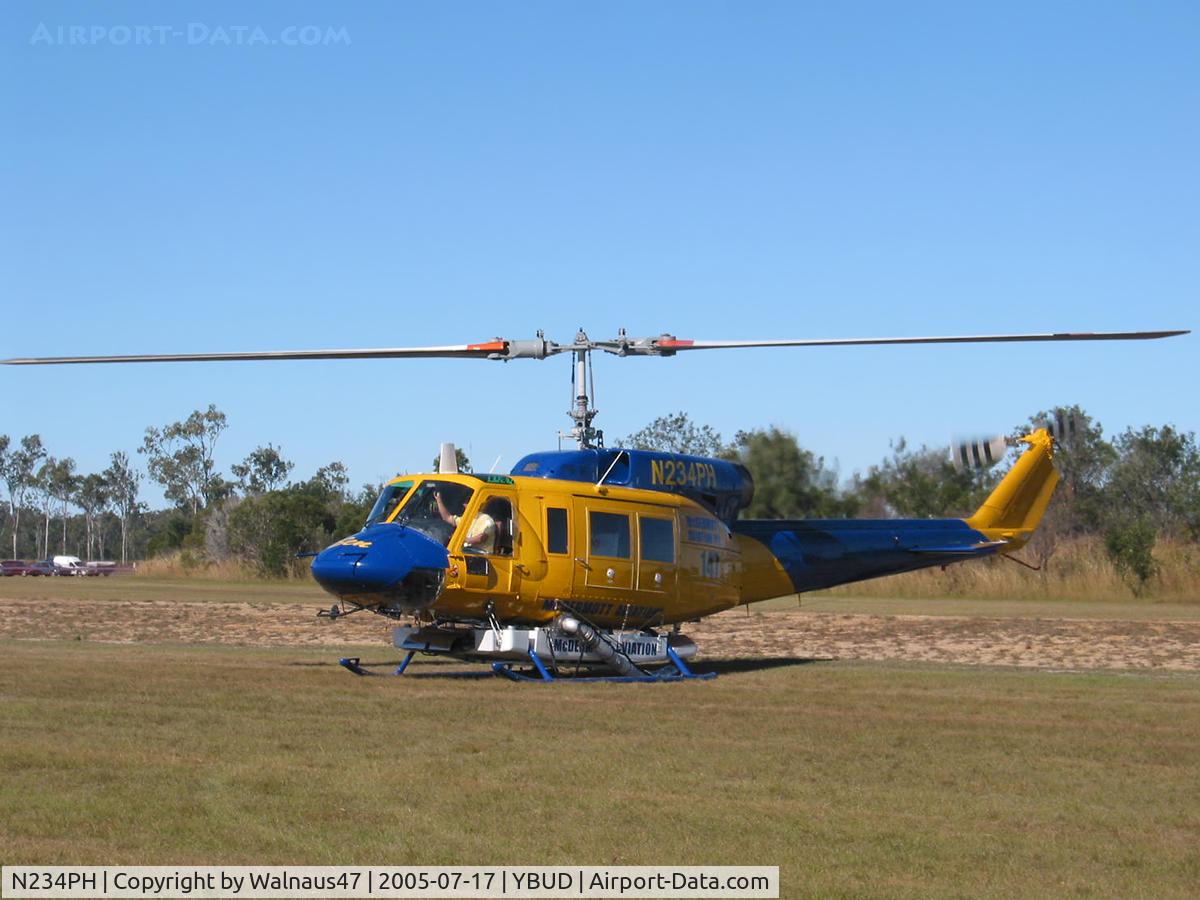 N234PH, 1977 Bell 214B-1 Biglifter C/N 28050, Front Portside view of McDermott Aviation Bell 214B-1 Biglifter N234PH Cn 28050 parked at Bundaberg Airshow at Bundaberg Airport YBUD on 17Jul2005. Equipped with ‘under-cabin’ water tank, with ‘pick-up’ hose retracted.