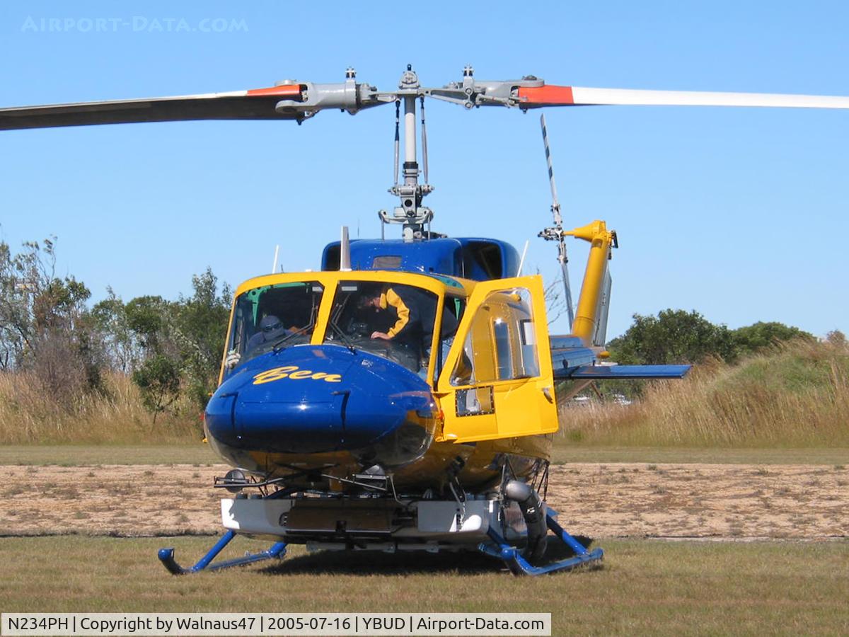 N234PH, 1977 Bell 214B-1 Biglifter C/N 28050, Close cropped Front view of McDermott Aviation Bell 214B-1 Biglifter N234PH Cn 28050 parked at Bundaberg Airshow at Bundaberg Airport YBUD on 16Jul2005. Equipped with ‘under-cabin’ water tank, with ‘pick-up’ hose retracted.