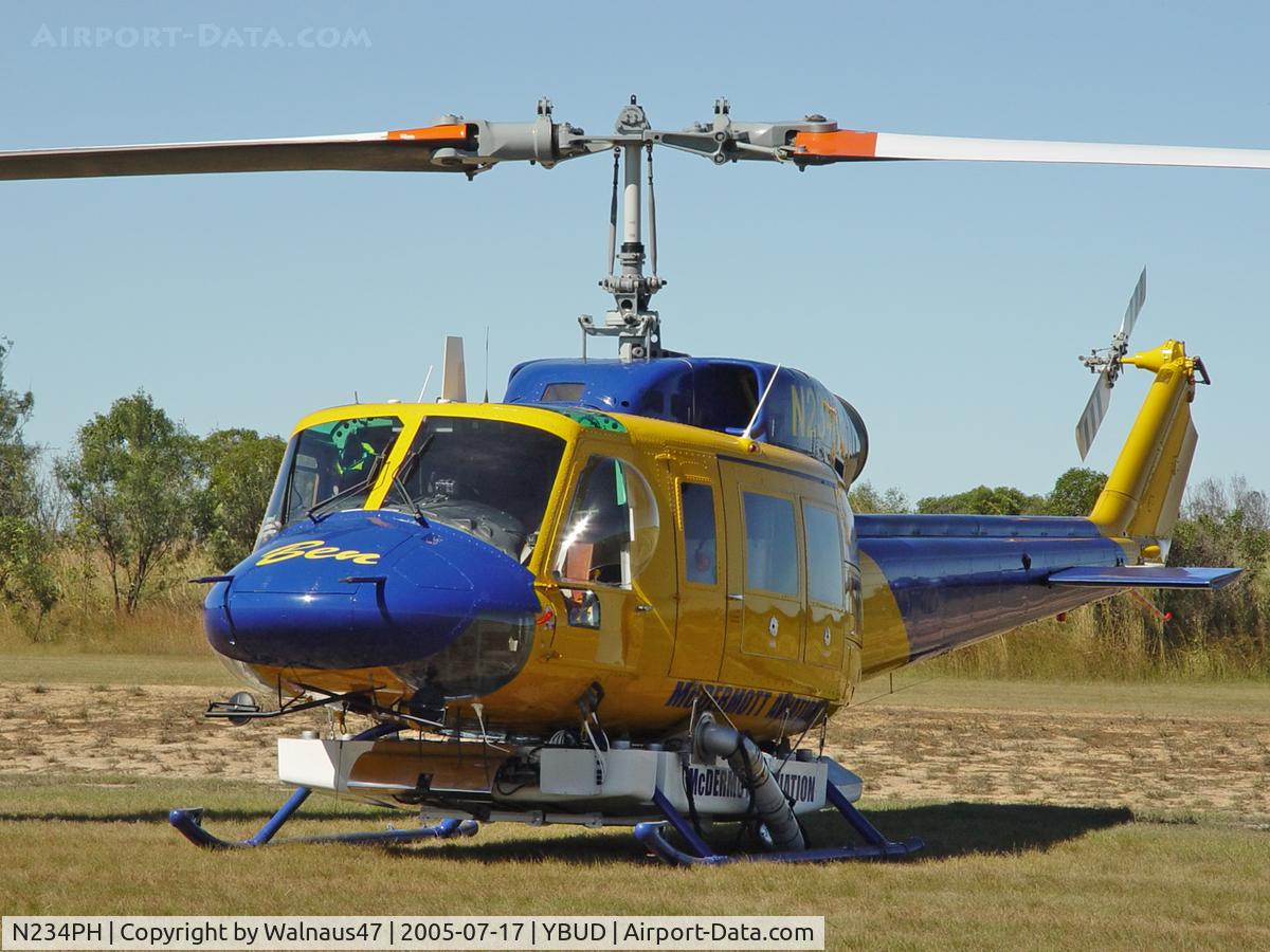N234PH, 1977 Bell 214B-1 Biglifter C/N 28050, Close cropped Front Portside view of McDermott Aviation Bell 214B-1 Biglifter N234PH Cn 28050 parked at Bundaberg Airshow at Bundaberg Airport YBUD on 17Jul2005. Equipped with ‘under-cabin’ water tank, with ‘pick-up’ hose retracted.
