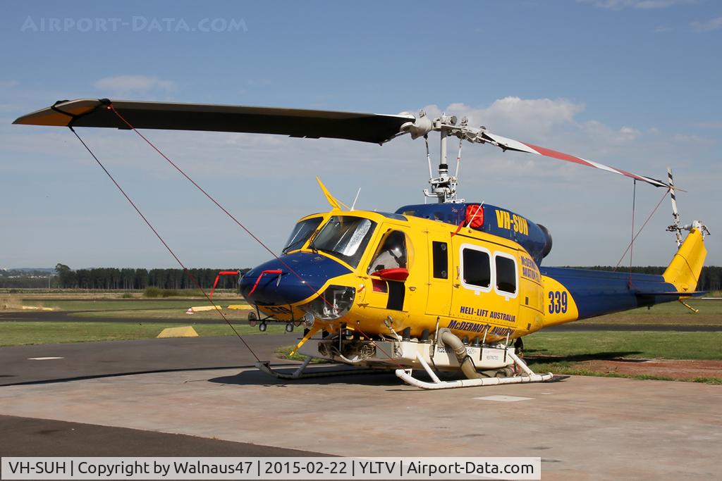 VH-SUH, 1976 Bell 214B-1 Biglifter Biglifter C/N 28017, Front Portside view of McDermott Aviation Bell 214B-1 VH-SUH Cn 28017 HeliTack 339, taken at Latrobe Valley Airport (YLTV) Morwell on 22Feb2015. Fitted with a ‘HeliLift’ water/ fire retardant tank under the cabin.