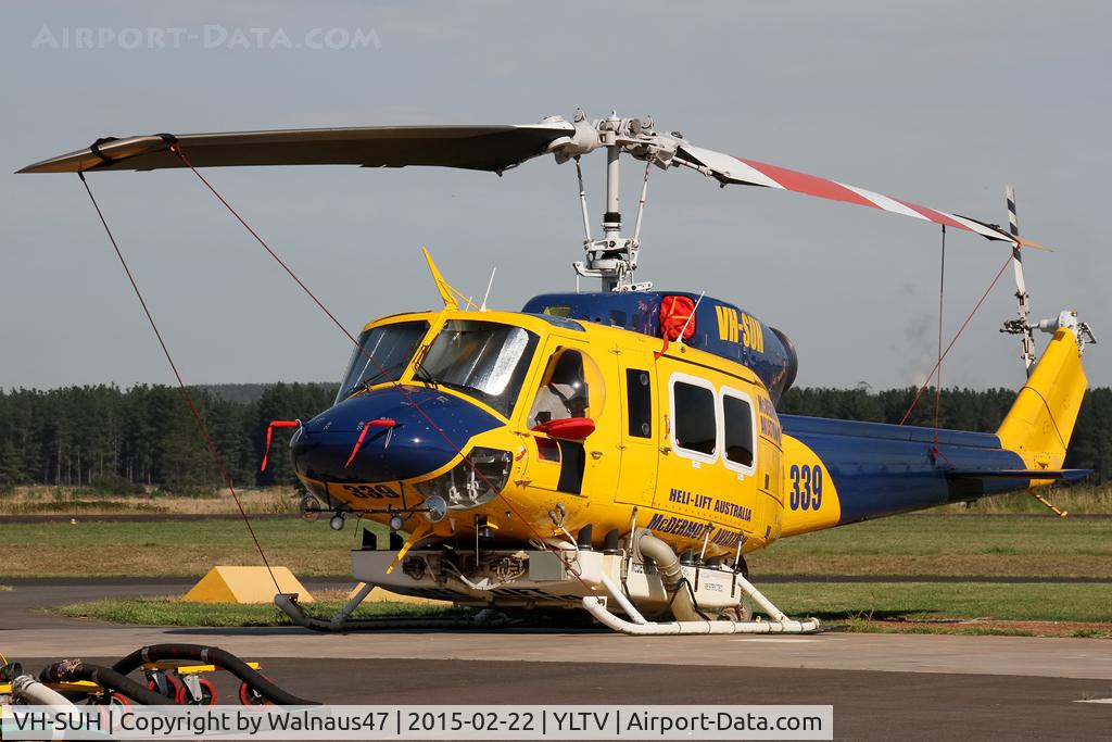 VH-SUH, 1976 Bell 214B-1 Biglifter Biglifter C/N 28017, Front Portside telephoto view of McDermott Aviation Bell 214B-1 VH-SUH Cn 28017 HeliTack 339, taken at Latrobe Valley Airport (YLTV) Morwell on 22Feb2015. Fitted with a ‘HeliLift’ water/ fire retardant tank under the cabin.