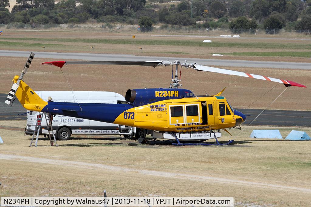 N234PH, 1977 Bell 214B-1 Biglifter C/N 28050, Stbd view of McDermott Aviation Bell 214B-1 Biglifter N234PH Cn 28050 under maintenance at Jandakot Airport YPJT West Australia on 18Nov2013. Equipped with ‘under-cabin’ water tank, with ‘pick-up’ hose, wearing Code Helitack 673.