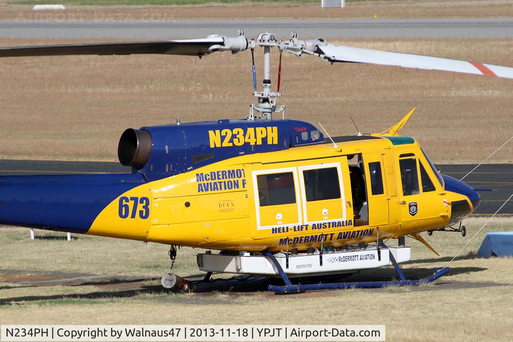 N234PH, 1977 Bell 214B-1 Biglifter C/N 28050, Stbd view of front end of McDermott Aviation Bell 214B-1 Biglifter N234PH Cn 28050 parked at Jandakot Airport YPJT West Australia on 18Nov2013. Equipped with ‘under-cabin’ water tank, with ‘pick-up’ hose, wearing Code Helitack 673.