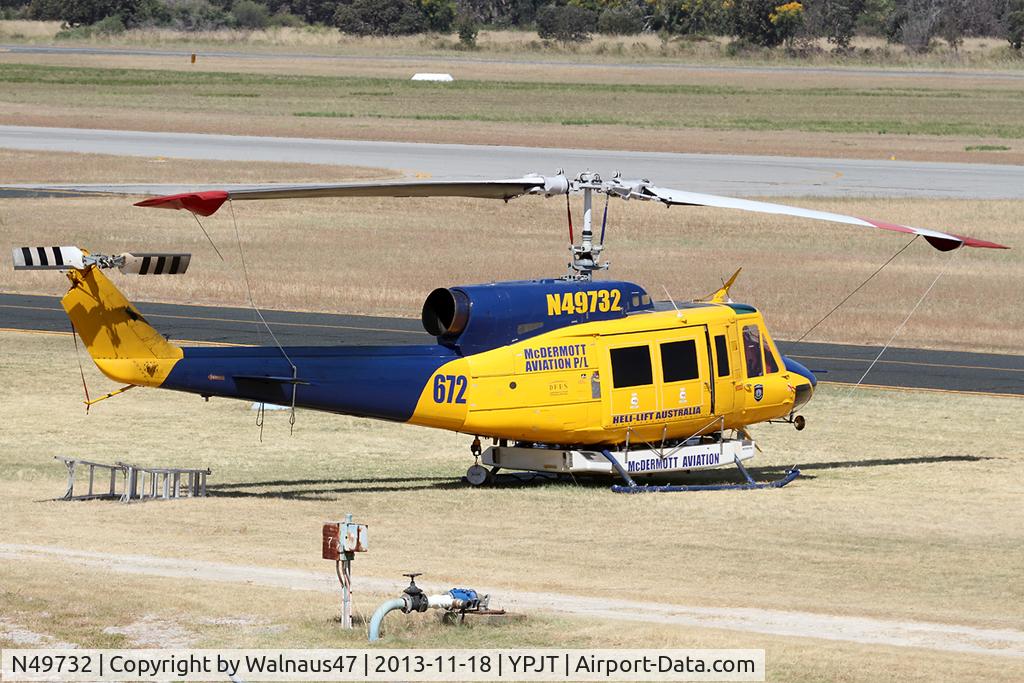 N49732, 1976 Bell 214B-1 Biglifter C/N 28005, Stbd view of McDermott Aviation Bell 214B-1 Biglifter N49732 Cn 28005 Helitack 672 parked at Jandakot Airport YPJT West Australia on 18Nov2013. Equipped with ‘under-cabin’ water tank, with ‘pick-up’ hose.