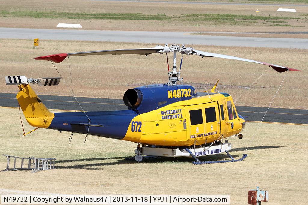 N49732, 1976 Bell 214B-1 Biglifter C/N 28005, Rear Stbd view of McDermott Aviation Bell 214B-1 Biglifter N49732 Cn 28005 Helitack 672 parked at Jandakot Airport YPJT West Australia on 18Nov2013. Equipped with ‘under-cabin’ water tank, with ‘pick-up’ hose.