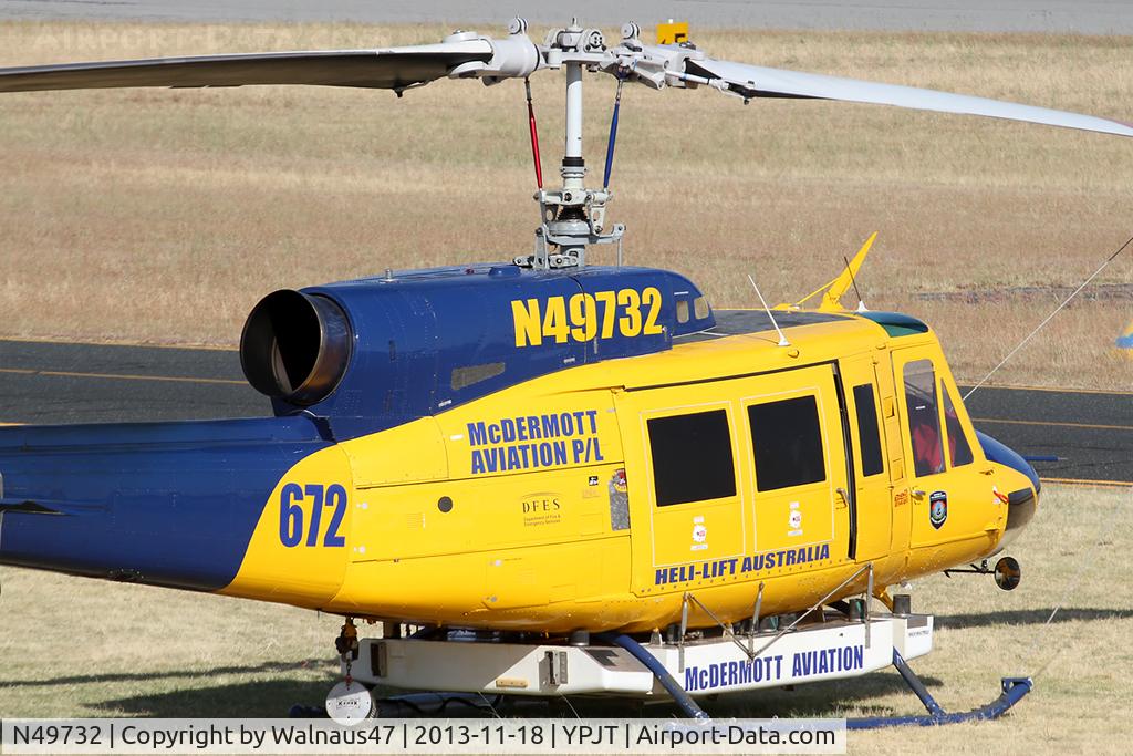 N49732, 1976 Bell 214B-1 Biglifter C/N 28005, Close-cropped Rear Stbd view of front end of McDermott Aviation Bell 214B-1 Biglifter N49732 Cn 28005 Helitack 672 parked at Jandakot Airport YPJT West Australia on 18Nov2013. Equipped with ‘under-cabin’ water tank, with ‘pick-up’ hose.