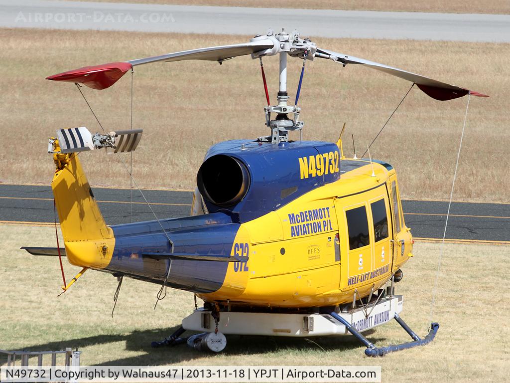 N49732, 1976 Bell 214B-1 Biglifter C/N 28005, Telephoto Rear Stbd view of McDermott Aviation Bell 214B-1 Biglifter N49732 Cn 28005 Helitack 672 parked at Jandakot Airport YPJT West Australia on 18Nov2013. Equipped with ‘under-cabin’ water tank, with ‘pick-up’ hose.