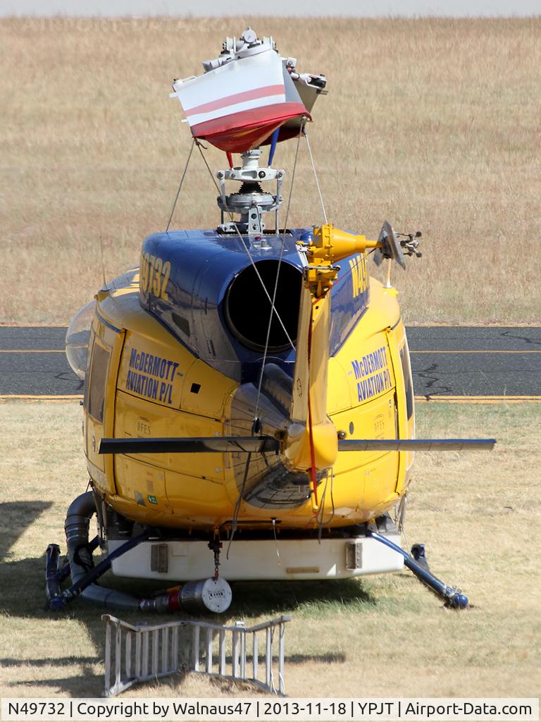 N49732, 1976 Bell 214B-1 Biglifter C/N 28005, Telephoto Rear view of McDermott Aviation Bell 214B-1 Biglifter N49732 Cn 28005 Helitack 672 parked at Jandakot Airport YPJT West Australia on 18Nov2013. Equipped with ‘under-cabin’ water tank, with ‘pick-up’ hose.