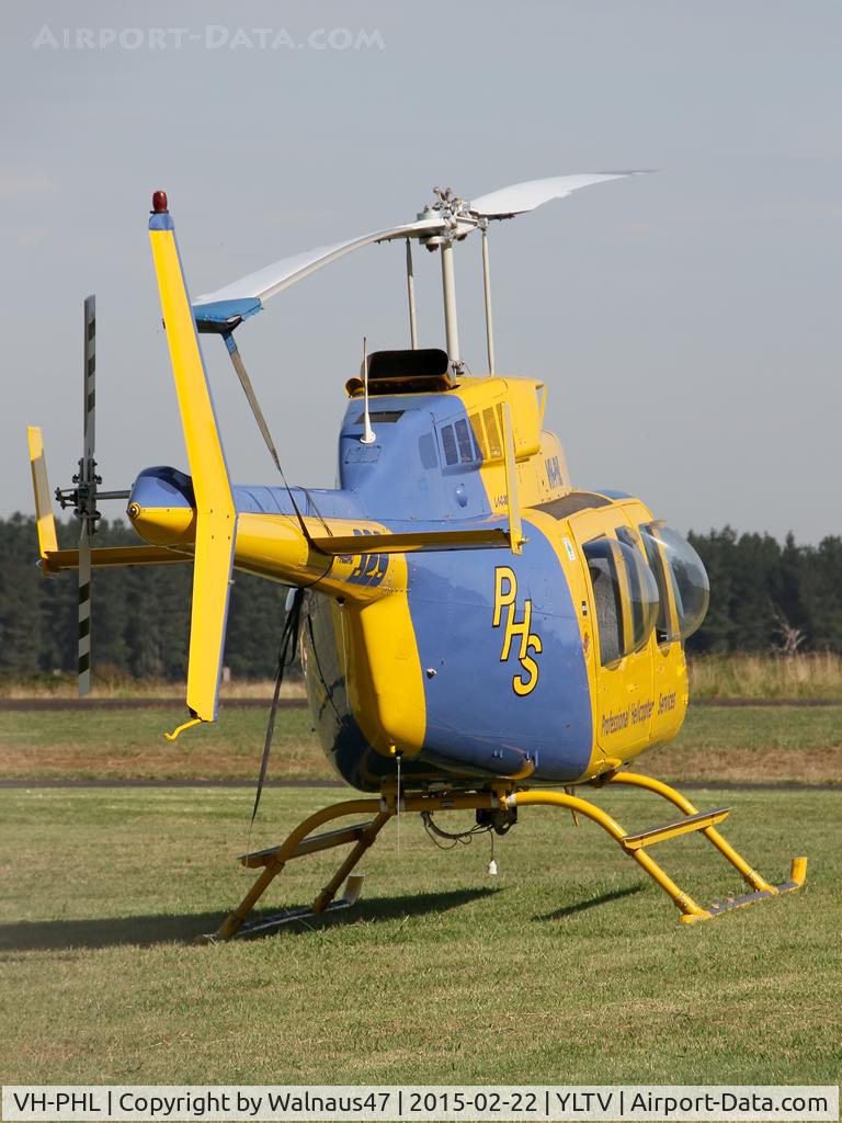 VH-PHL, 1978 Bell 206L-1 LongRanger II C/N 45177, Rear view of Blue/ Yellow livery Professional Helicopter Services (PHS) Bell 206L-1 LongRanger VH-PHL Cn 45177 parked at Latrobe Valley Airport (YLTV) Morwell on 22Feb2015. The helo has ‘bubble windows’ and wore Code Firebird 329.