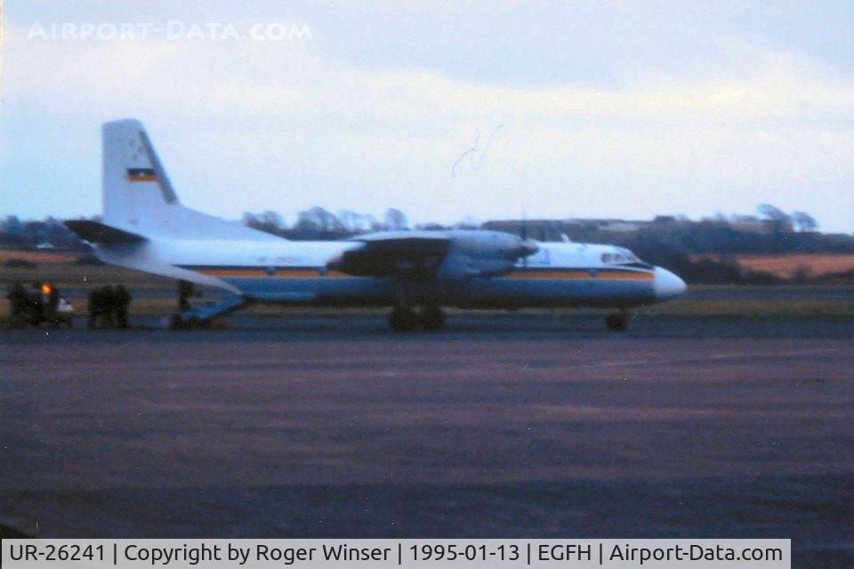 UR-26241, 1977 Antonov An-26 C/N 909, A poor photo of Busol Airlines An-26 aircraft visiting Swansea Airport at dusk on 13th January 1995.