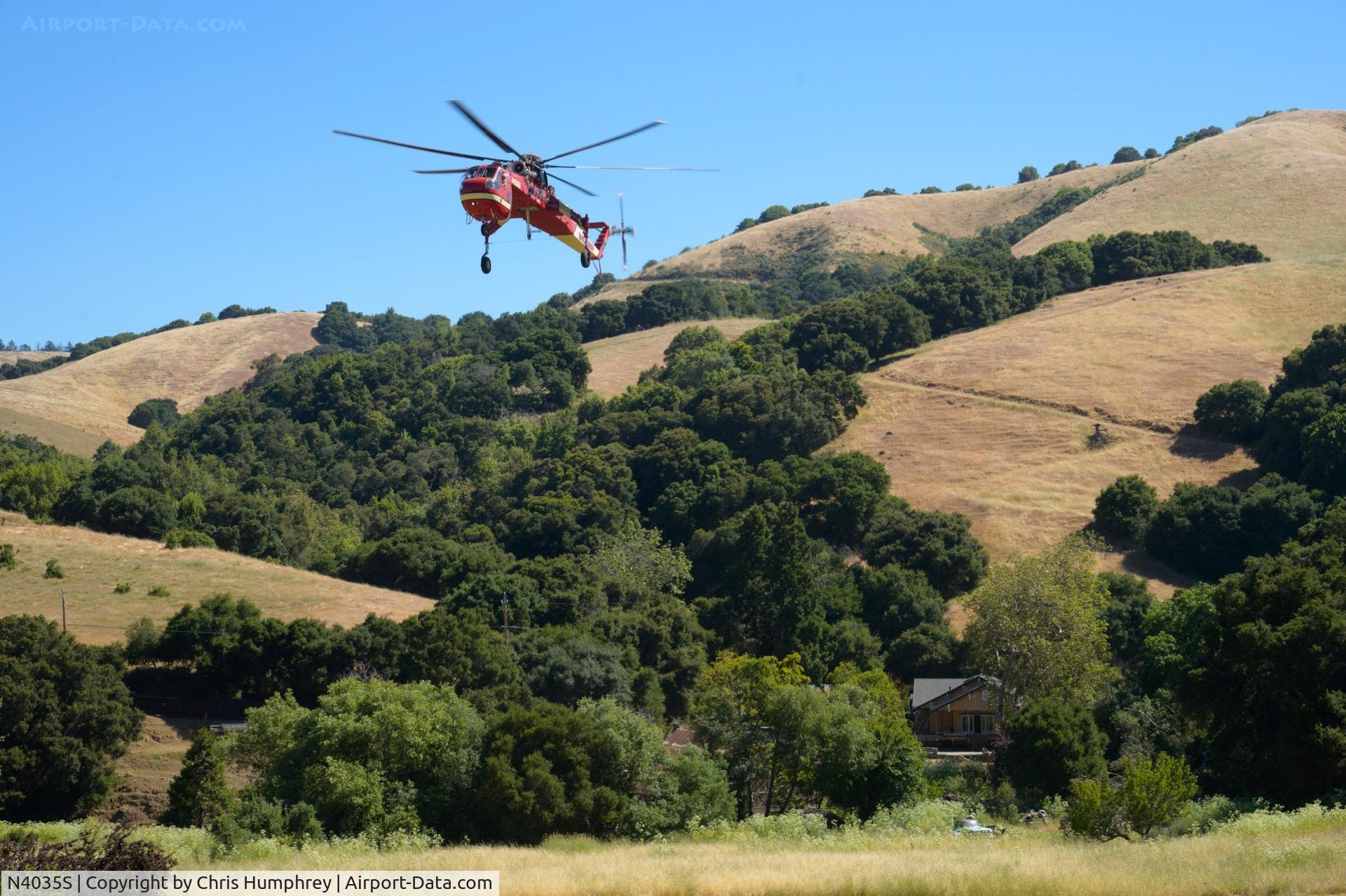 N4035S, 1975 Sikorsky S-64E C/N 64099, Assisting with the movement of equipment to shore up a persistent mud slide in Castro Valley California.