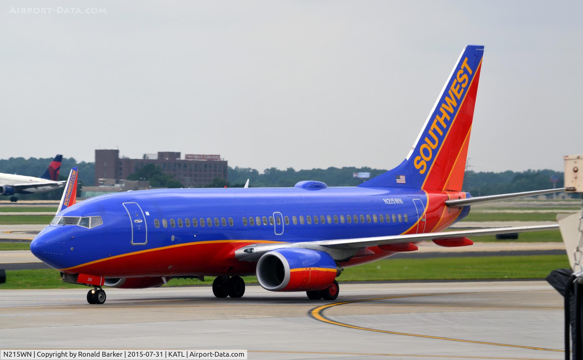 N215WN, 2005 Boeing 737-7H4 C/N 32487, Taxi Atlanta  Named in honor of Ron Chapman, a Dallas DJ who I listened to on KLIF (1190 AM)  and KVIL (103.7 FM)