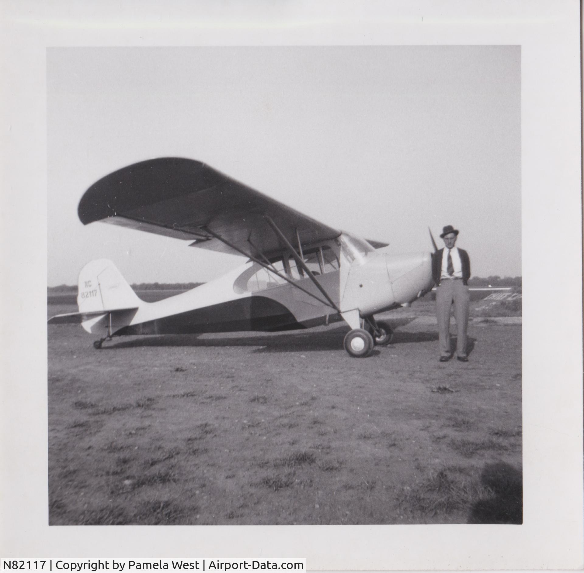 N82117, 1946 Aeronca 7AC Champion C/N 7AC-743, Herman Lee Walker with plane he co-owned with friend, possibly at the Monmouth, Warren, IL, airport.  First entry in log book w/ this plane was Feb. 1948.  Last was Sep 1953.