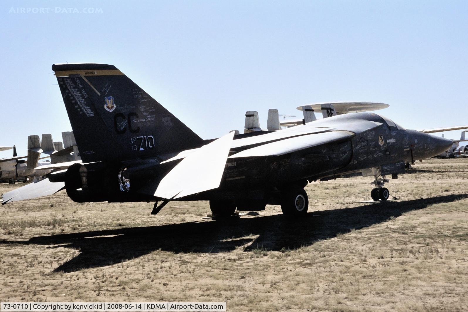 73-0710, 1973 General Dynamics F-111F C/N E-85, At Davis Monthan from an air-conditioned bus, circa 1996.