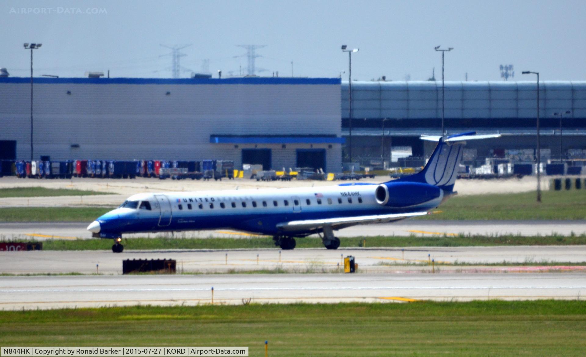 N844HK, 2004 Embraer ERJ-145LR (EMB-145LR) C/N 14500838, Taxi O'Hare