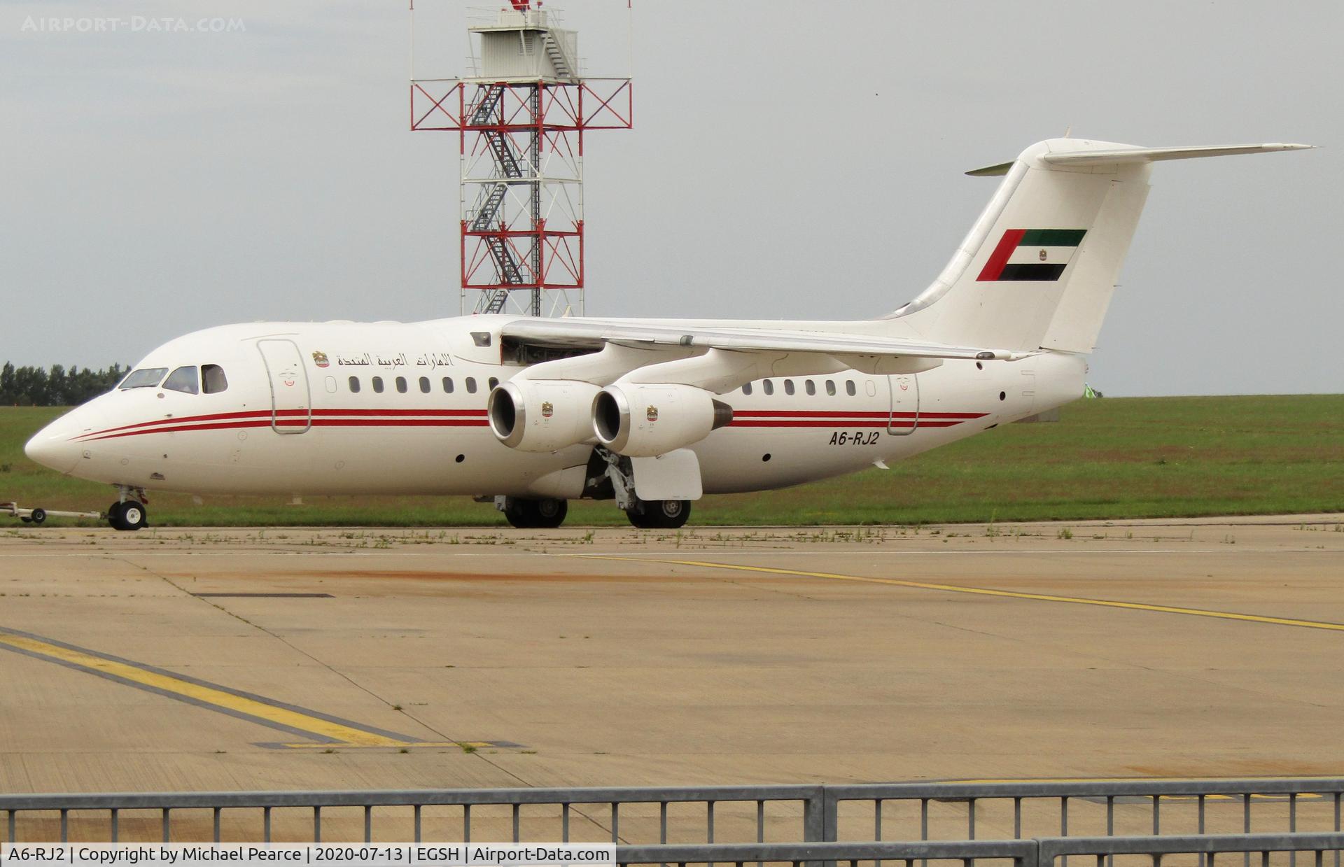 A6-RJ2, 1998 British Aerospace Avro 146-RJ85A C/N E2325, Under tow for engine runs after maintenance.