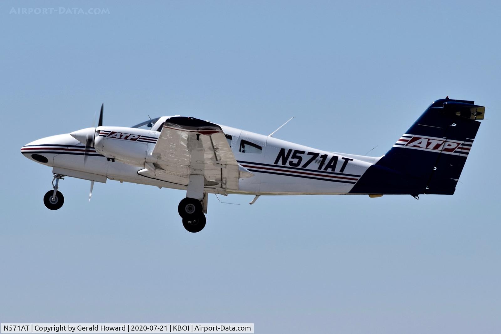 N571AT, 2005 Piper PA-44-180 Seminole C/N 4496193, Climb out from 10L.