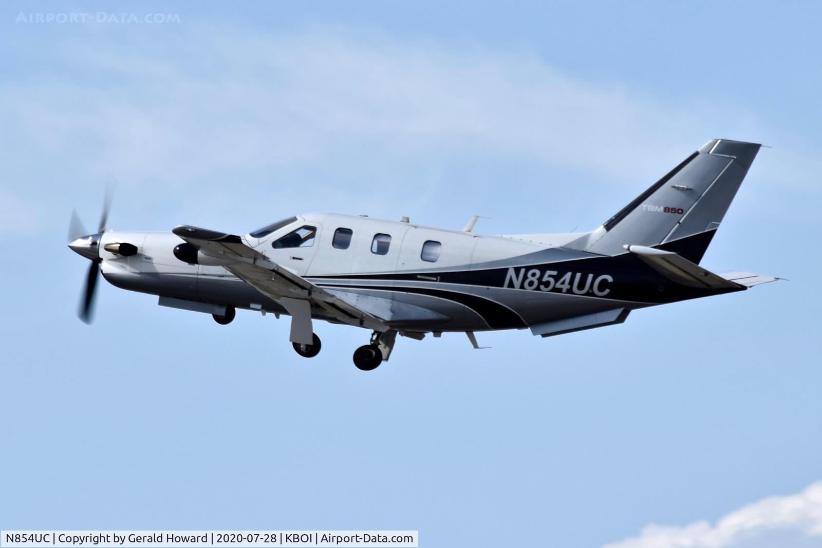 N854UC, 2012 Socata TBM-700 C/N 644, Climb out from 10L.