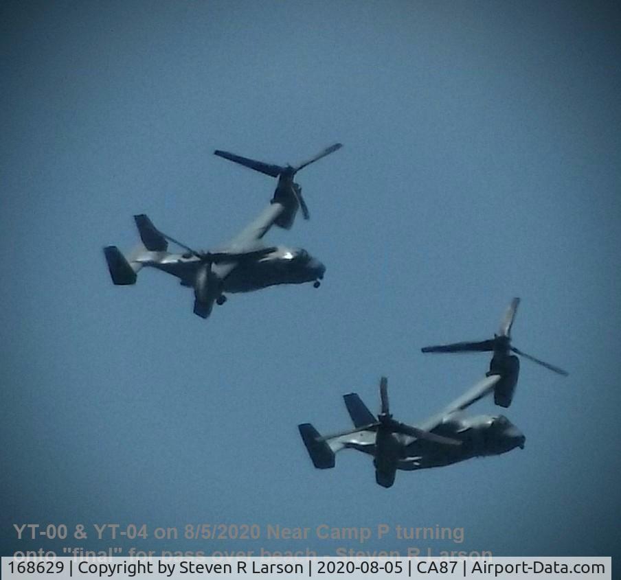 168629, Bell-Boeing MV-22B Osprey C/N D0284, YT-04 (believed on right and leading YT-00) turning to fly along beach.  A low quality far away shot, but wanted to share the 2-shot of them.