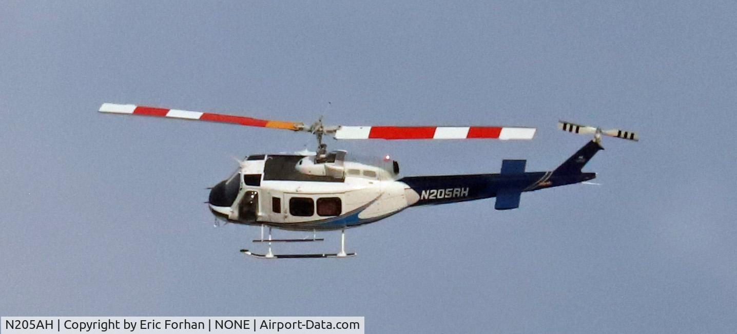 N205AH, Bell 205A-1 C/N 30206, Flying over East Wenatchee, WA