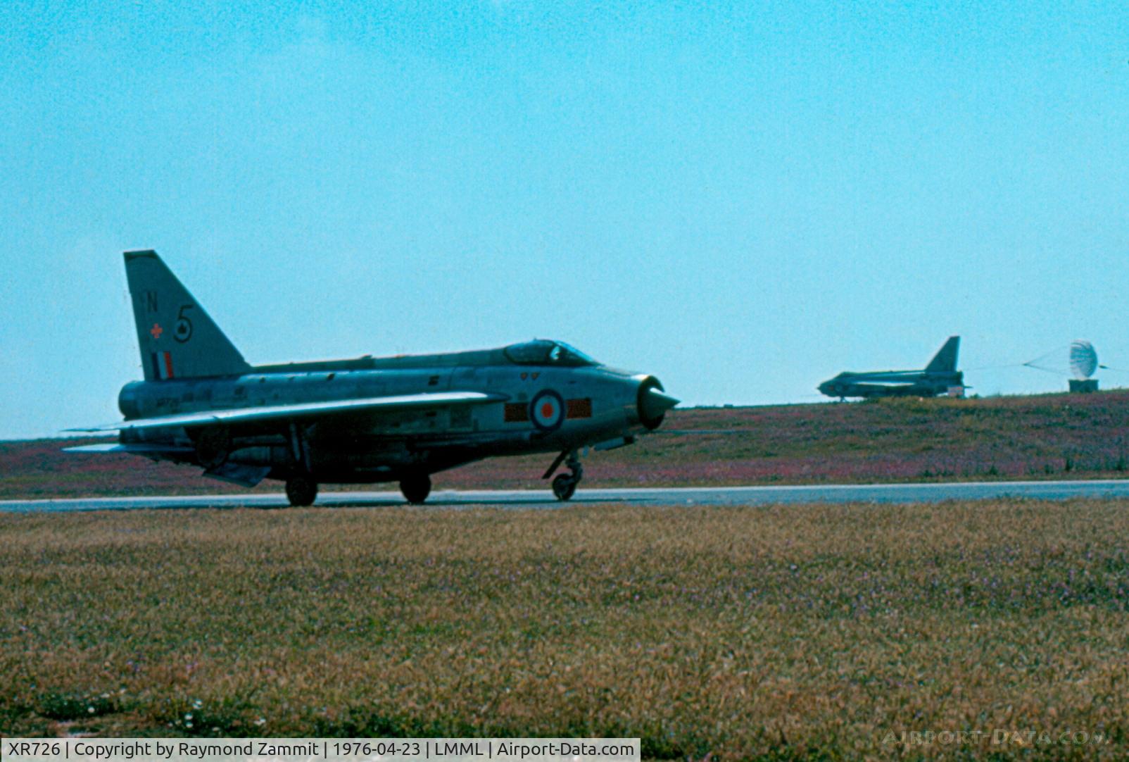 XR726, 1965 English Electric Lightning F.6 C/N 95209, E.E Lightning F.6 XR726/N 5Sqdn Royal Air Force seen taxying out for the sortie while a company aircraft is seen streaming on the runway on landing.
