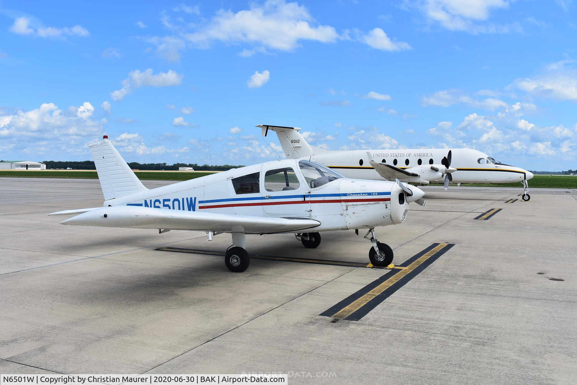 N6501W, 1964 Piper PA-28-140 C/N 28-20578, 01W next to United States Army Beech 1900 at Columbus, Indiana
