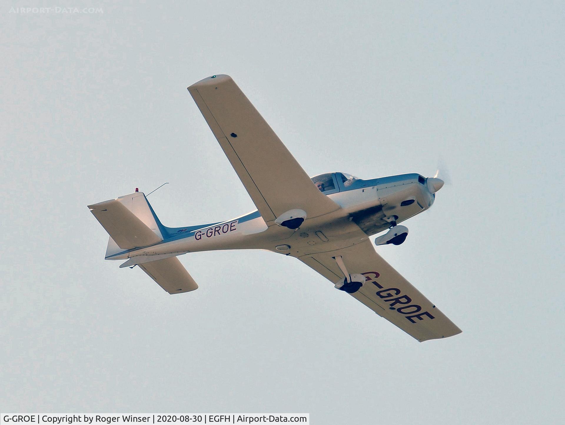 G-GROE, 1989 Grob G-115 C/N 8054, Visiting G-115 overhead the airport..