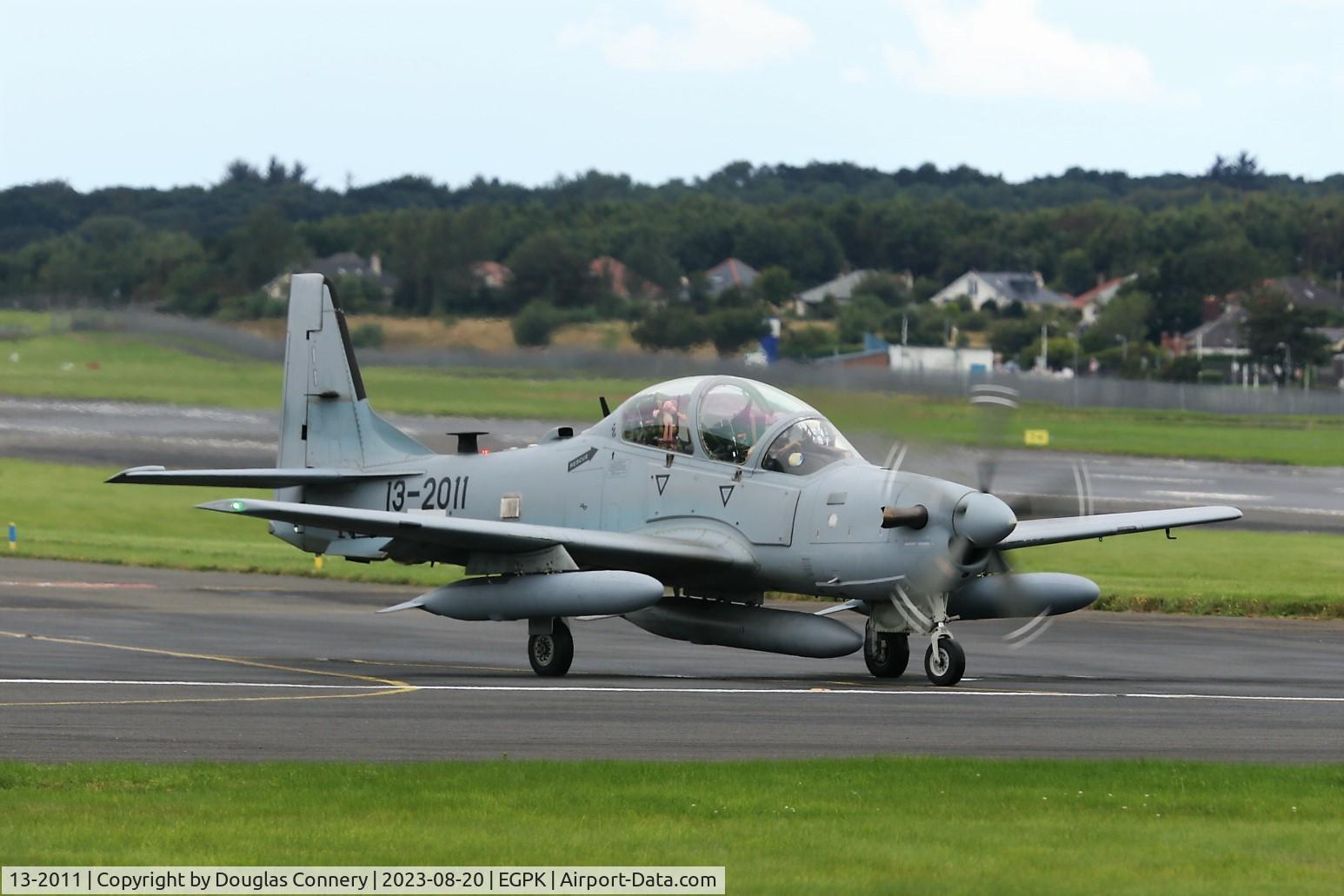 13-2011, Embraer A-29A Super Tucano (EMB-314) C/N 31400211, Afghan AF A-29 Super tucano taxiing for departure at Prestwick, did you notice the Pink Panther in the back seat?
