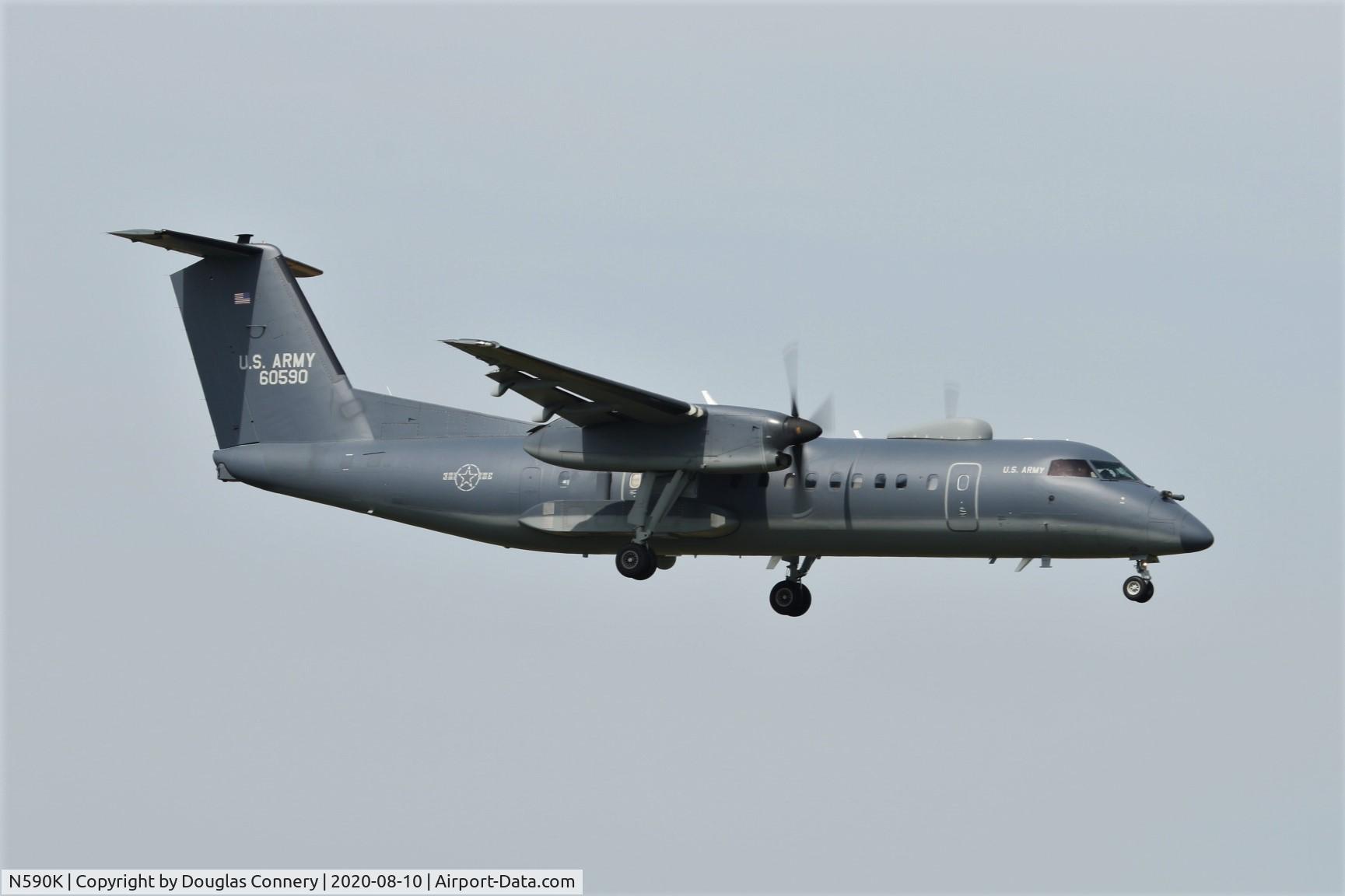 N590K, 2005 Cessna T206H Turbo Stationair C/N T20608519, US Army DHC-8 on finals for runway 12 at Prestwick C/S Polar 90