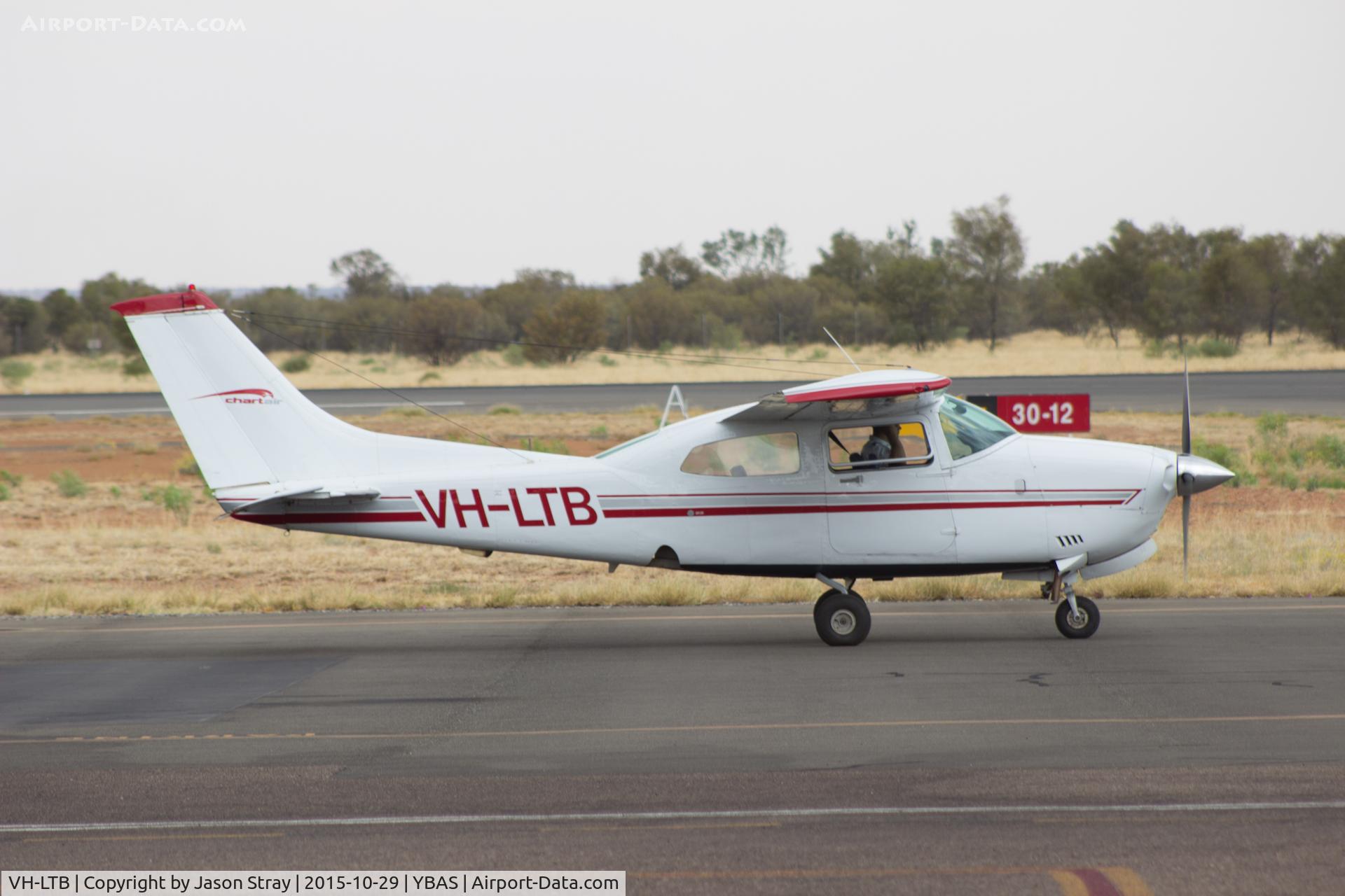 VH-LTB, 1982 Cessna 210N Centurion C/N 21064679, On taxiway at YBAS Alice Springs NT, Owned by Chartair Ltd, taxiing to runway 12 for departure to YHMB
