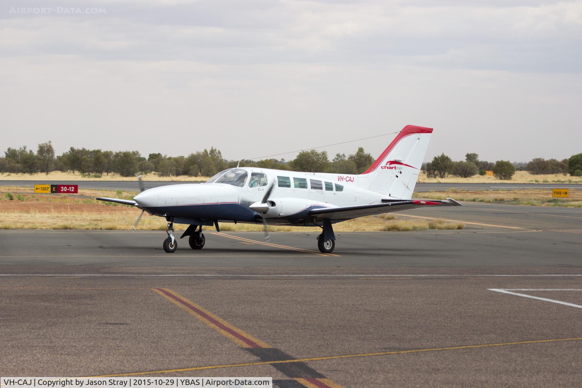 VH-CAJ, Cessna 402C C/N 402C0026, Taxiing from 30 to GA YBAS Alice Springs NT after arrival from YTNK Operated by Chartair Pty Ltd