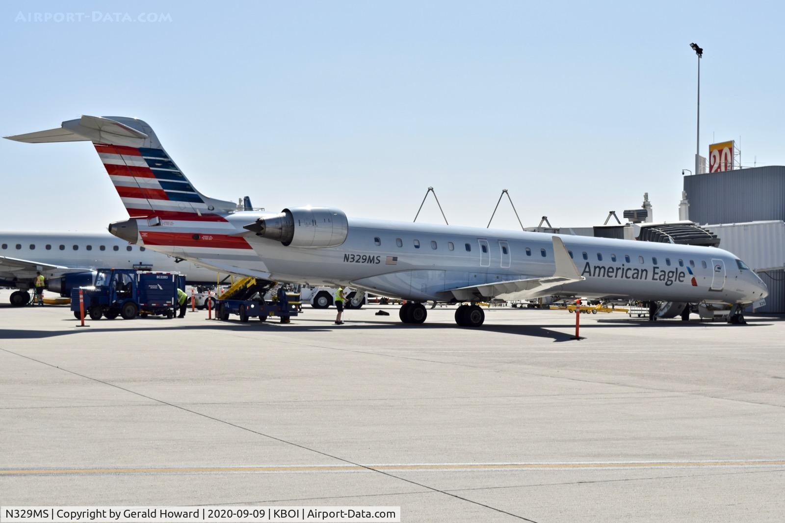 N329MS, 2008 Bombardier CRJ-900ER NG (CL-600-2D24) C/N 15126, Parked at the gate.