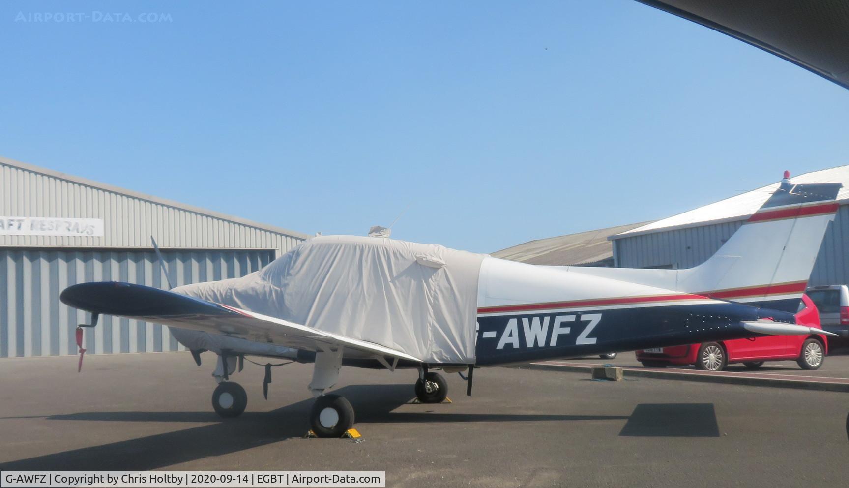 G-AWFZ, 1968 Beech A23-19 Musketeer Sport III C/N MB-323, Parked and covered at Turweston, Bucks outside paint hangar.