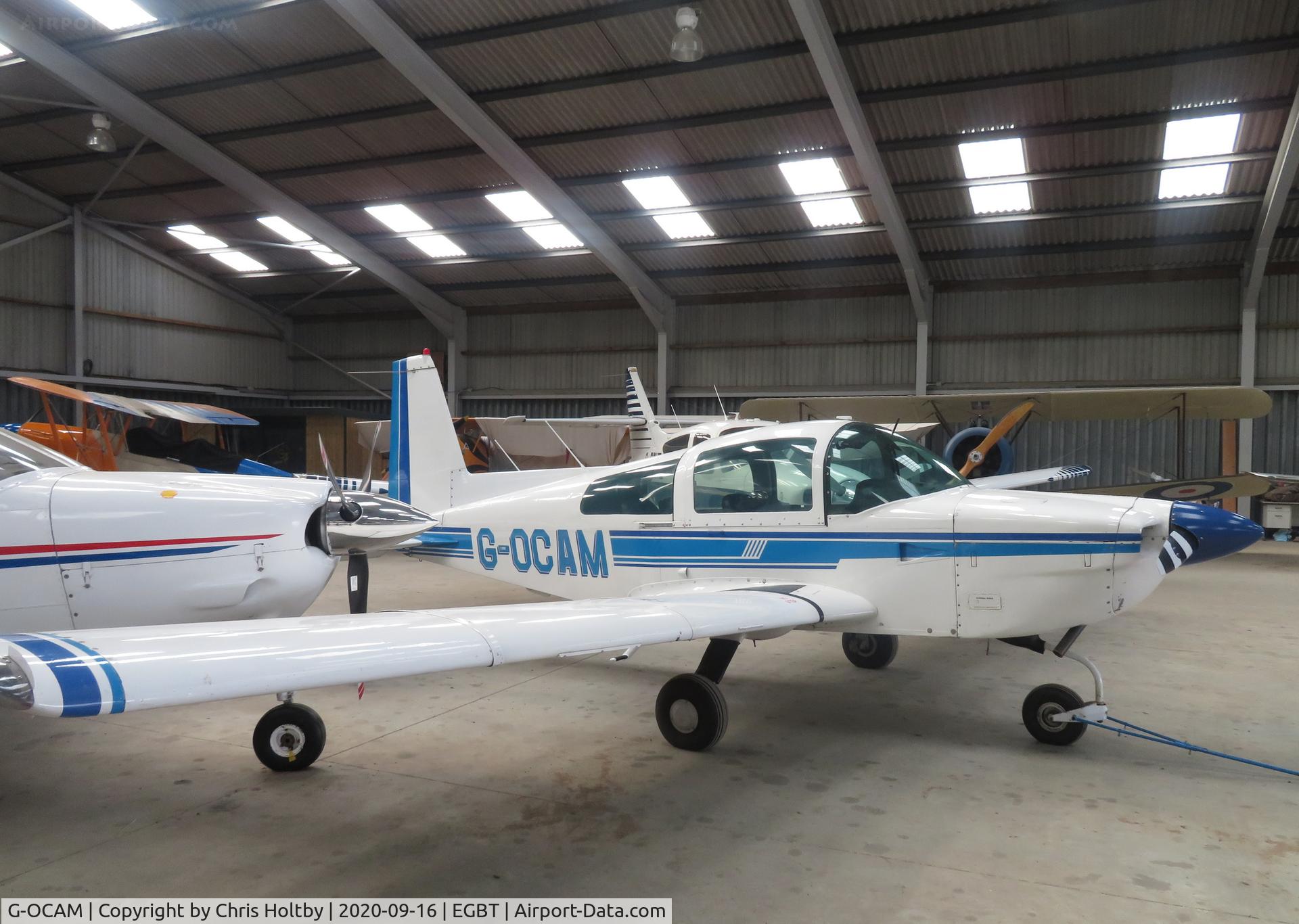 G-OCAM, 1979 Gulfstream American AA-5A Cheetah C/N AA5A-0741, Parked in the hangar at Turweston, Bucks.