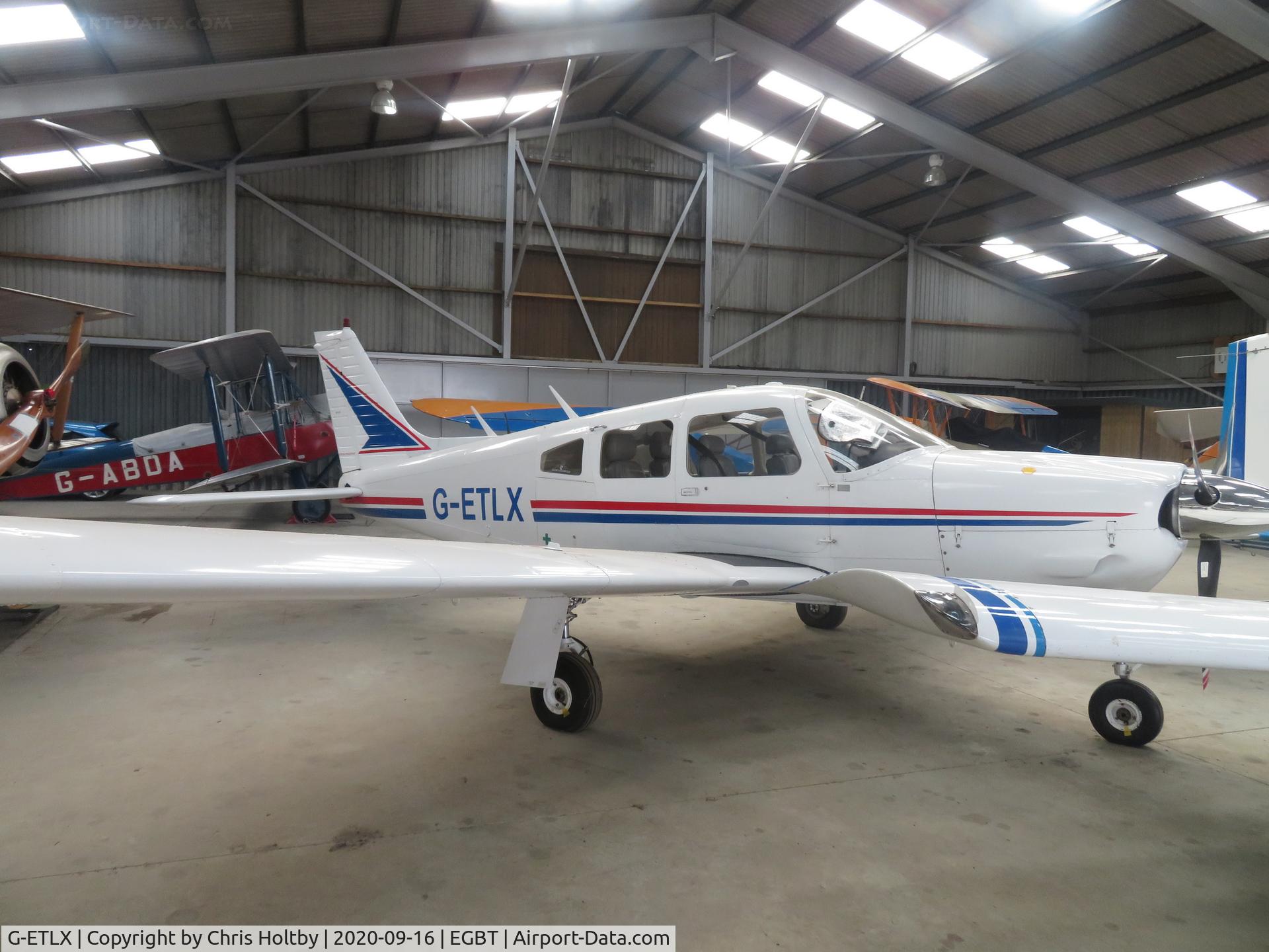 G-ETLX, 1976 Piper PA-28R-200 Cherokee Arrow II C/N 28R-7635119, In the hangar at Turweston, Bucks