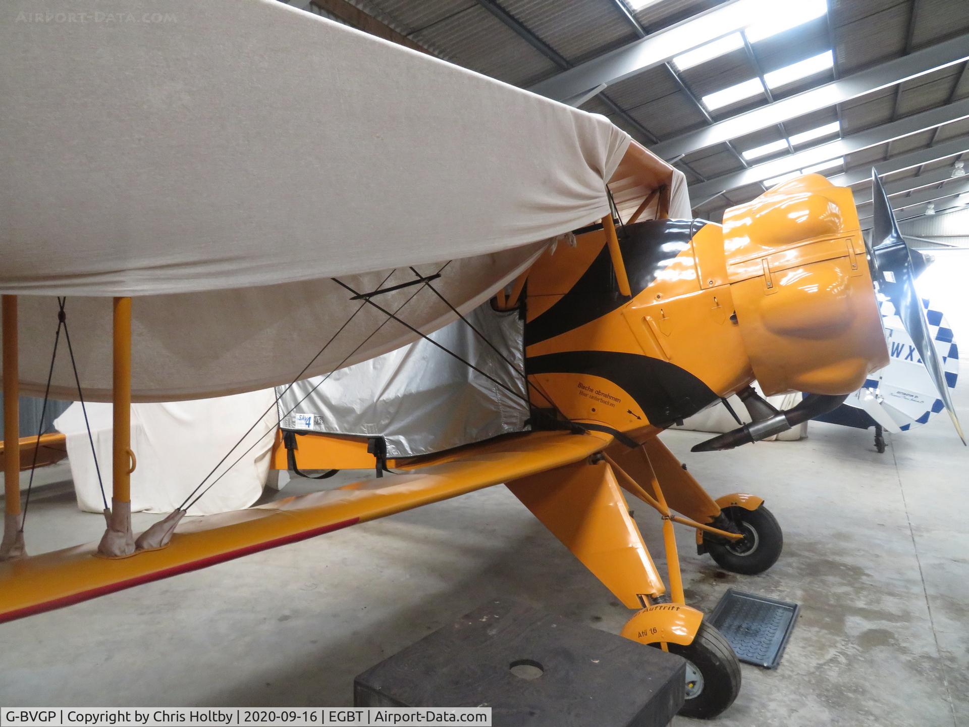 G-BVGP, 1940 Doflug Bu-133C Jungmeister C/N 42, Covered up in the hangar at Turweston.