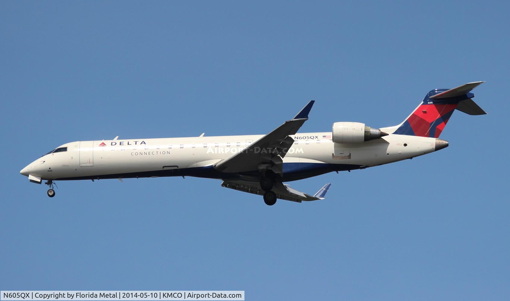 N605QX, 2002 Bombardier CRJ-701 (CL-600-2C10) Regional Jet C/N 10022, MCO 2014