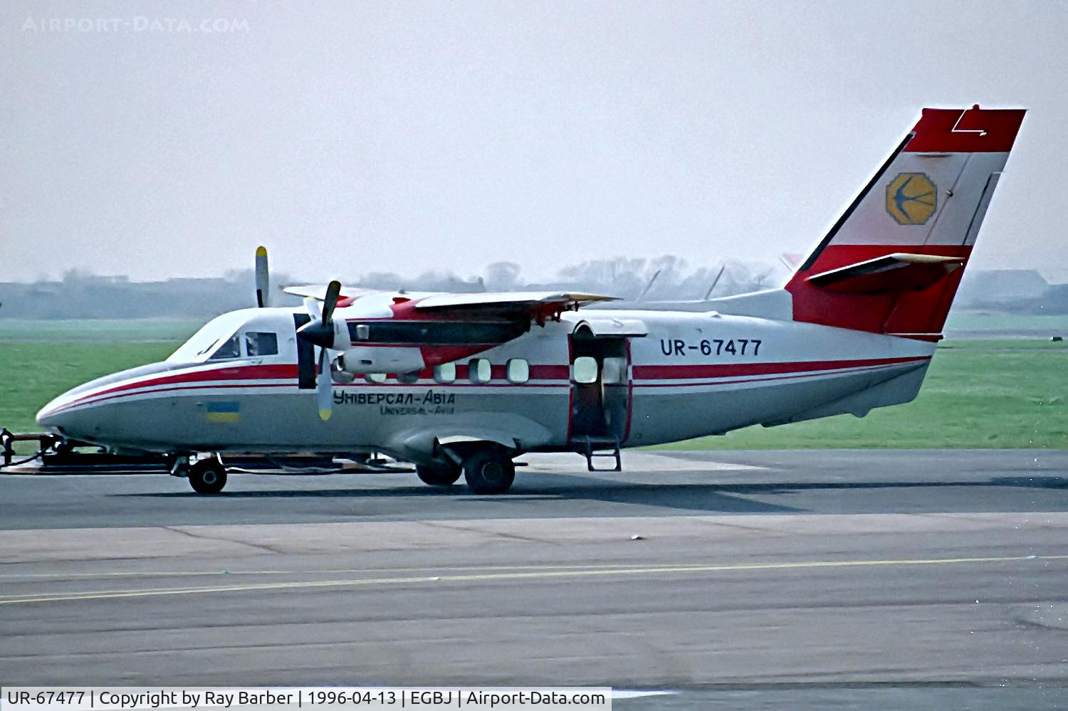 UR-67477, 1984 Let L-410UVP Turbolet C/N 841302, UR-67477   Let L-410 UVP Turbolet [841302] (Universal Avia) Staverton~G 13/04/1996 . Seen here with normal door. Another image shows a parachutist door.