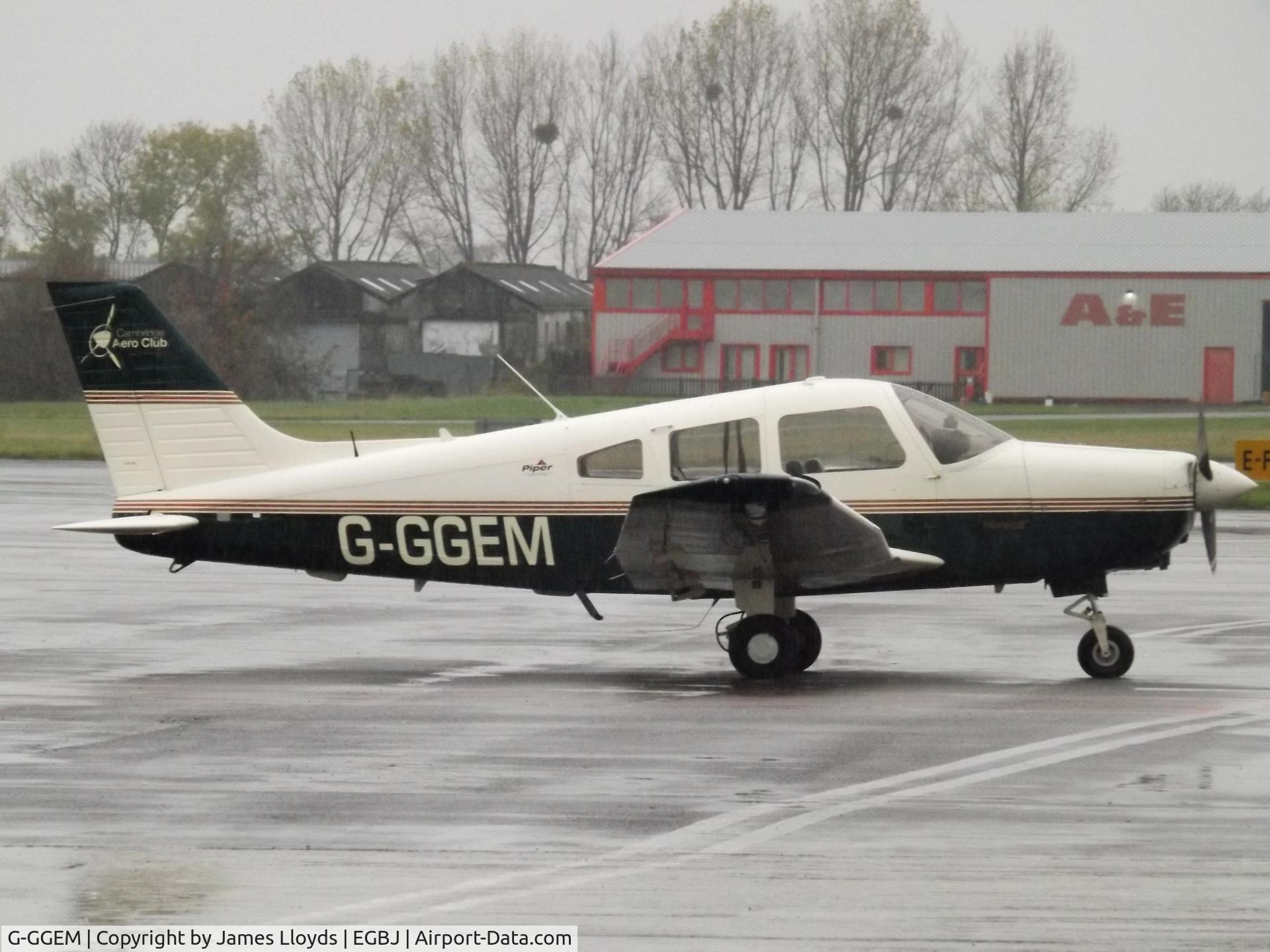 G-GGEM, 2003 Piper PA-28-161 Cherokee Warrior III C/N 2842185, Parked up at a wet Gloucestershire Airport.