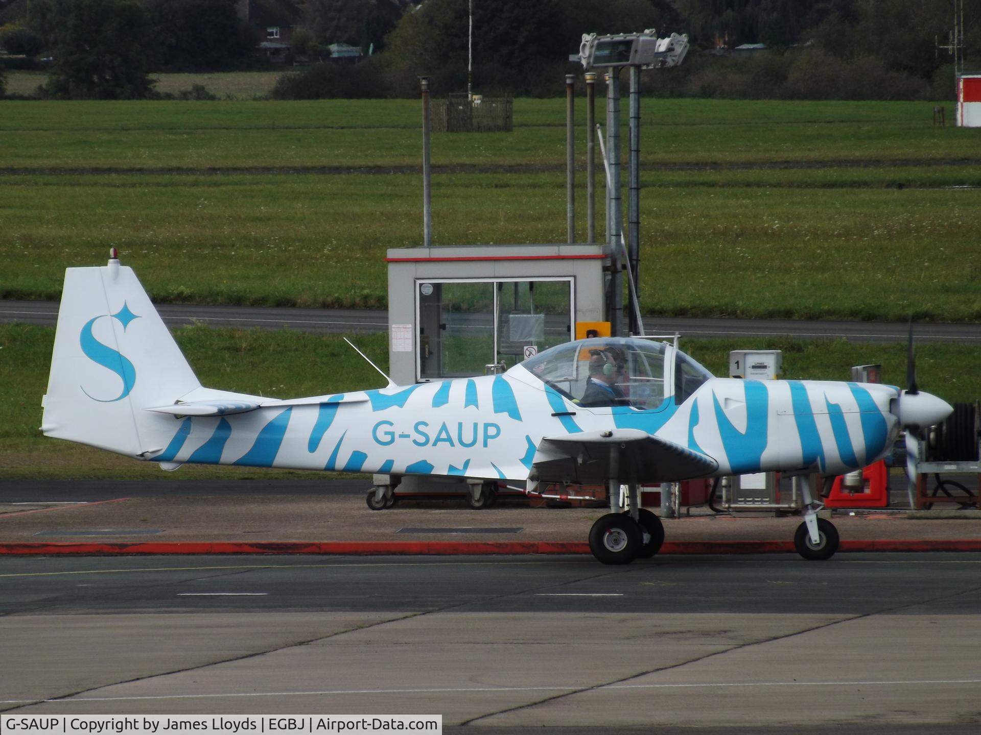 G-SAUP, 1987 Slingsby T-67M-200 Firefly C/N 2046, Parked at the fuel pumps at Gloucestershire Airport.