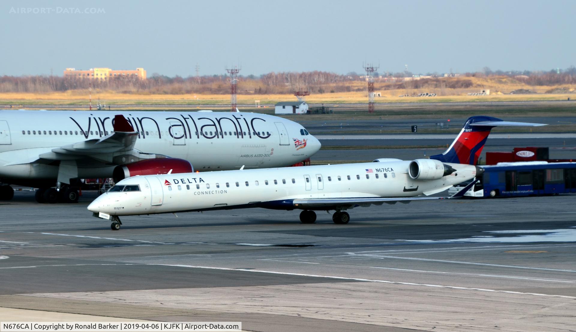 N676CA, 2007 Bombardier CRJ-900ER (CL-600-2D24) C/N 15127, Taxi to park  JFK
