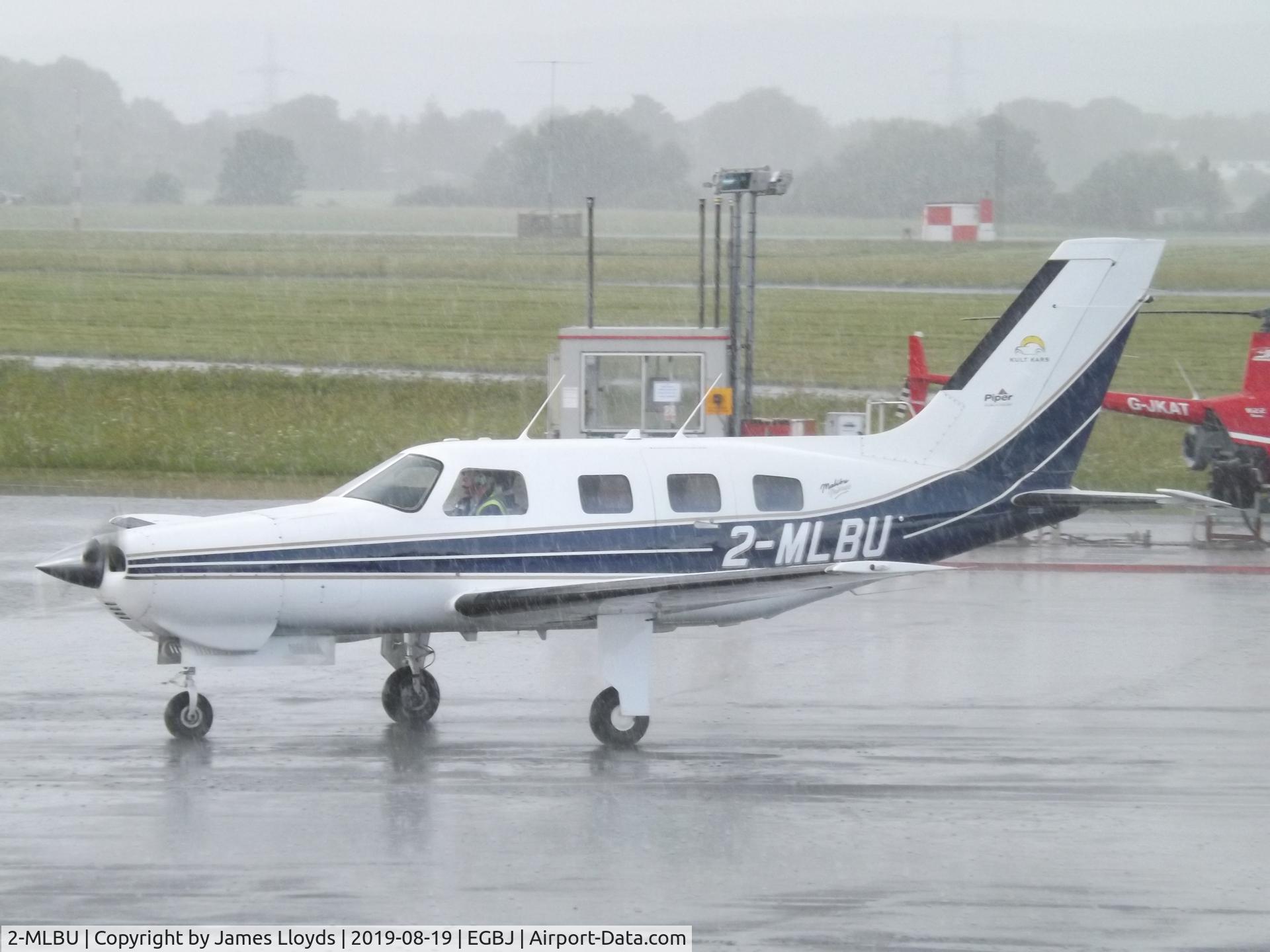 2-MLBU, Piper PA-46-350P Malibu Mirage Malibu Mirage C/N 4636110, Taxing in at a wet Gloucestershire Airport.
