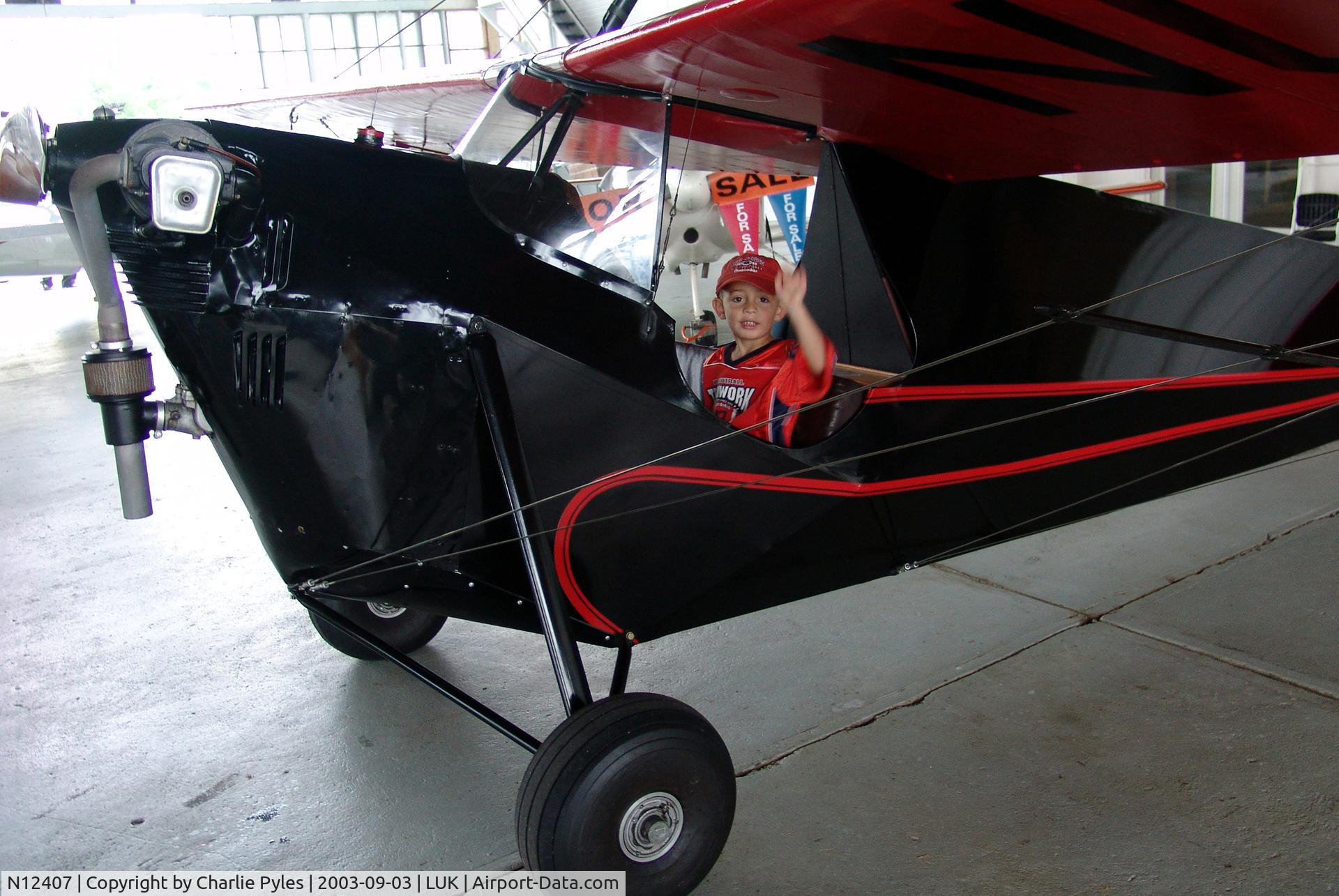 N12407, 1932 Aeronca C-3 C/N A-173, My 3YO Grandson Blake in Jim Hammond's C-3 at the airport where it was built. This kid wouldn't fit in there with a shoehorn now.  He's 20YO and almost 6'5