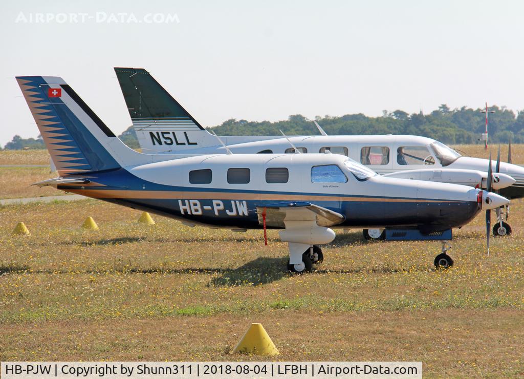 HB-PJW, 1988 Piper PA-46-310P Malibu C/N 4608128, Parked in the grass...