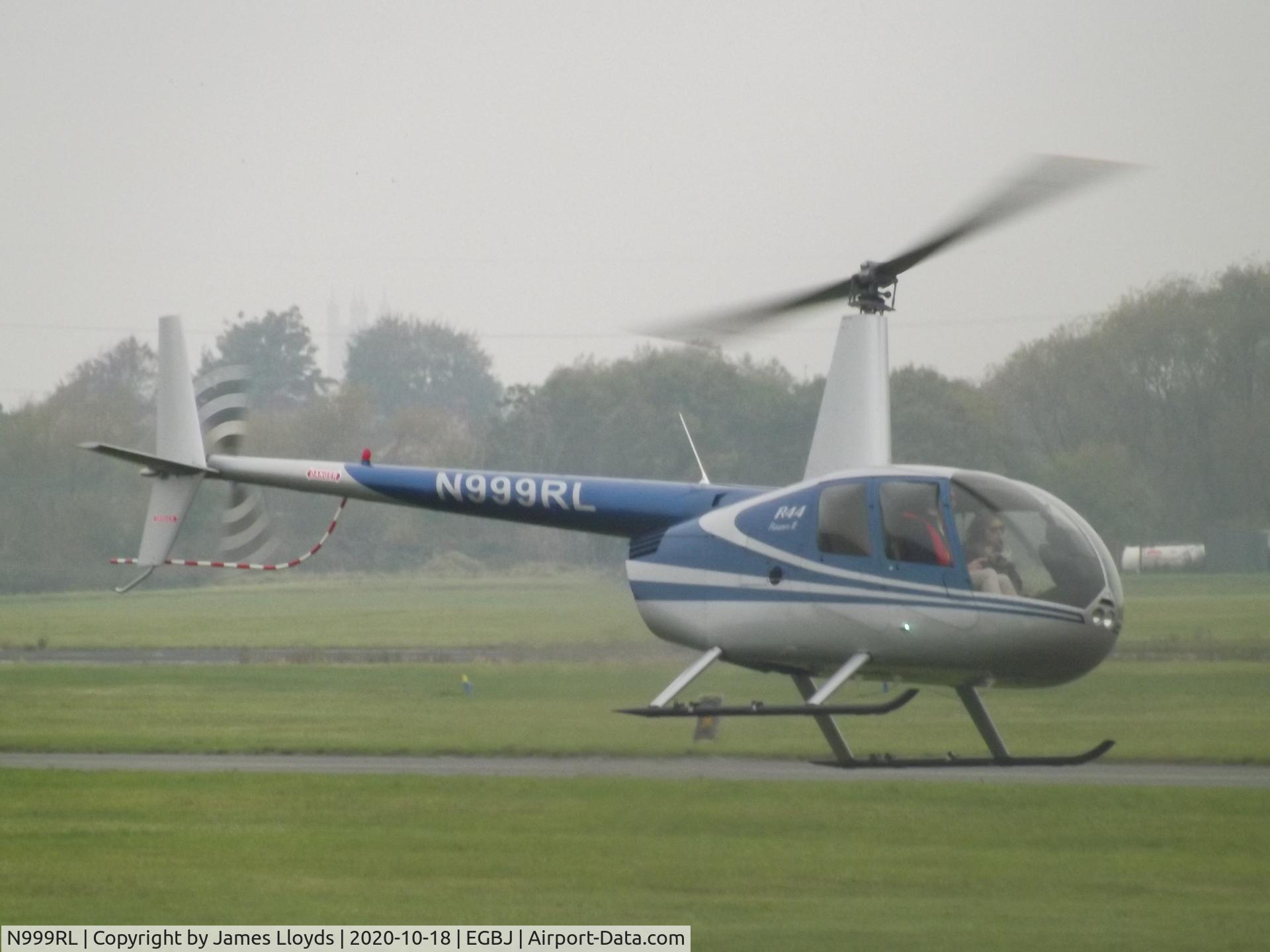 N999RL, 2005 Robinson R44 II C/N 10614, Arriving at Gloucestershire Airport.