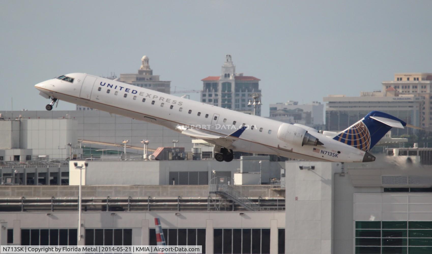 N713SK, 2004 Bombardier CRJ-701ER (CL-600-2C10) Regional Jet C/N 10174, MIA spotting 2014